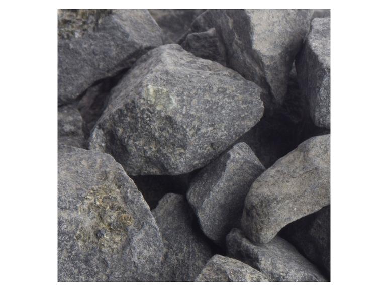 Haufen grauer, rauer Steine, geeignet für Gartendekoration oder Bauzwecke.