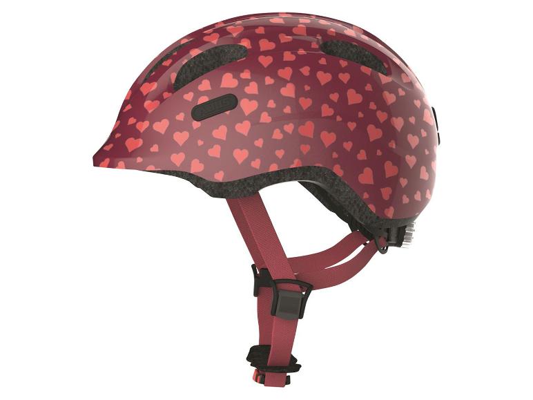 ABUS Kinderfahrradhelm mit Herzchenmuster.