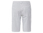 Weiße Caprihose mit schwarzem Muster.