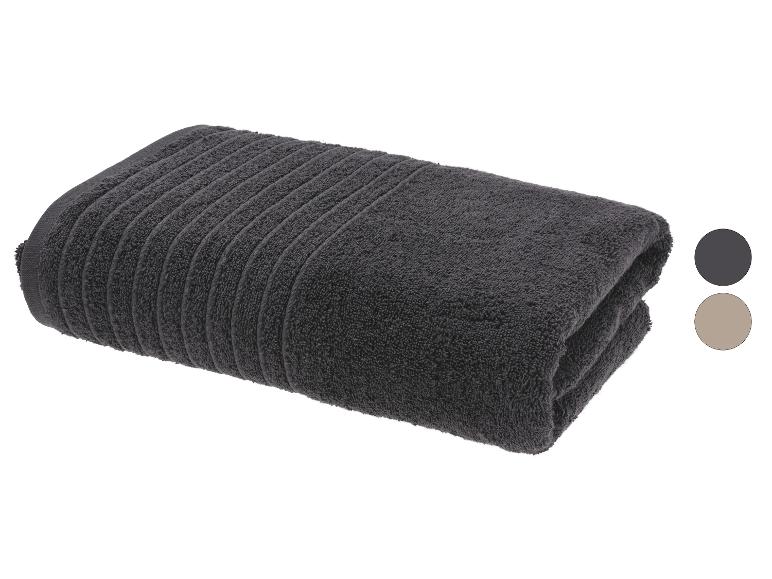 Dunkelgraues Handtuch mit Streifenmuster, gefaltet, mit Farbmustern an der Seite