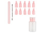 Nagelfeile, Nagelhaut-Schieber, Flasche und zehn rosa Nagelclips.