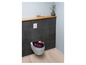 Toilettendeckel mit Blumendruck in einem Badezimmer.