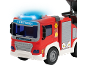 Rotes Spielzeug-Feuerwehrauto mit blauen Blinklichtern und der Aufschrift „FIRETUCK“.