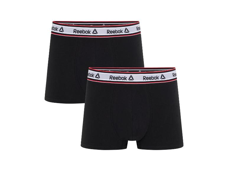 Zwei schwarze Reebok Boxershorts mit weißem und rotem Bund.