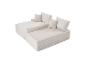 Zweiteiliges beiges Modulsofa mit Kissen, mit Cord-Textur.