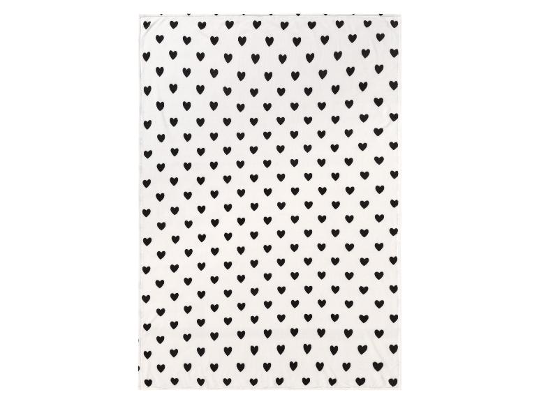 Weiße Decke mit schwarzen Herzen