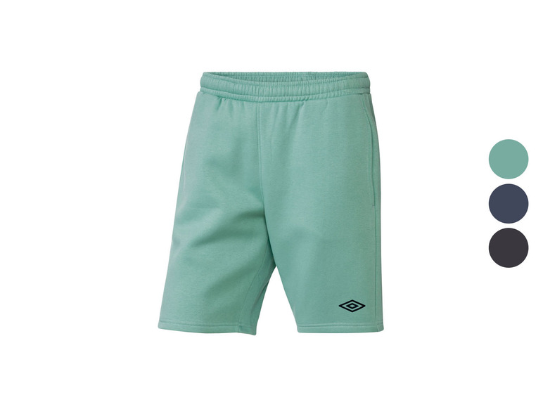 Grüne Trainingshose mit kleinem Diamantenlogo.