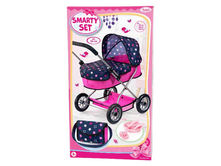 Ein rosa Puppenwagen mit Sternenmuster von Bayer Design.