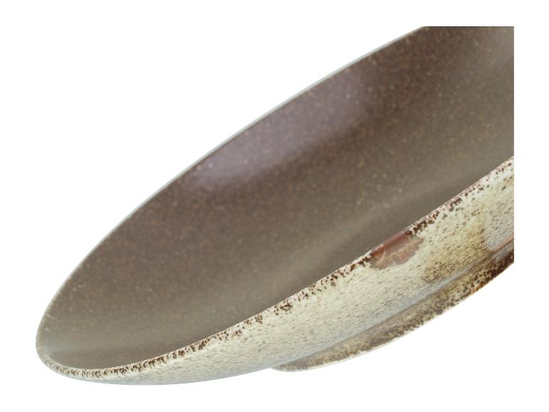 Eine braune Keramikschüssel mit rauer Textur.