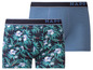 Zwei Boxershorts von Happy Socks, eine mit tropischem Muster und eine einfarbige.