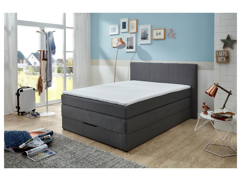 Modernes graues Bett mit Stauraum.