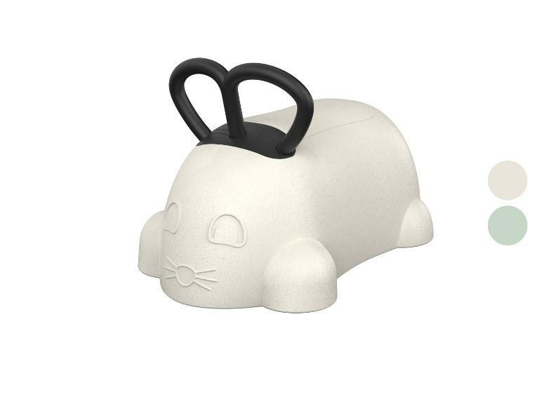 Hüpfspielzeug für Kinder in Form eines weißen Hasen mit schwarzen Griffen.