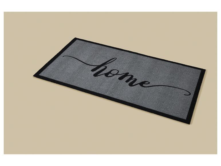 Graue Fußmatte mit schwarzem „home“-Schriftzug