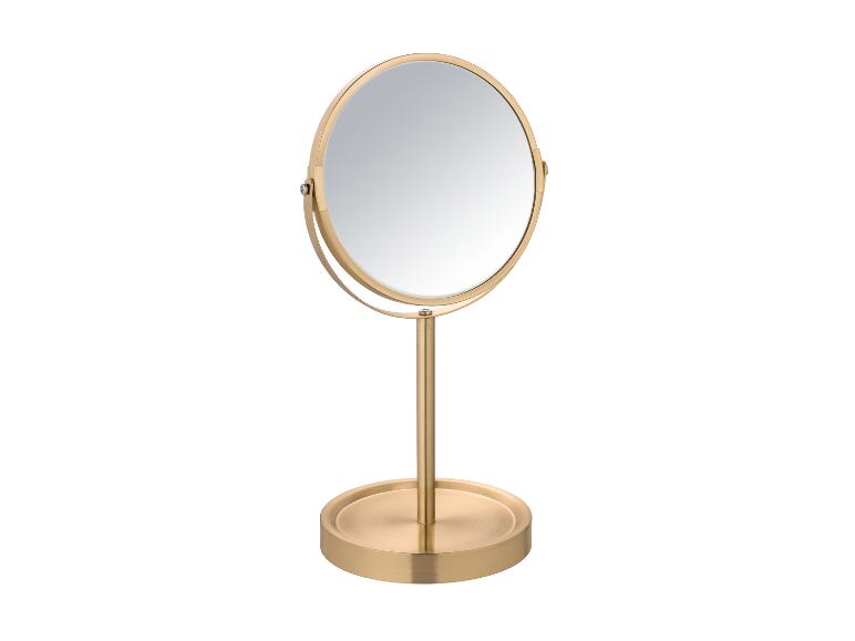 Goldfarbener Tischspiegel mit rundem Rahmen.
