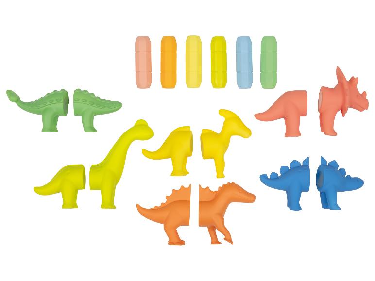 Set bunter Dinosaurier-Spielzeuge mit austauschbaren Teilen und Aufbewahrungskapseln.