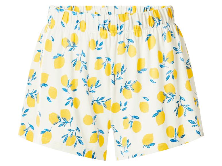 Weiße Shorts mit gelbem Zitronen- und blauem Blättermuster.