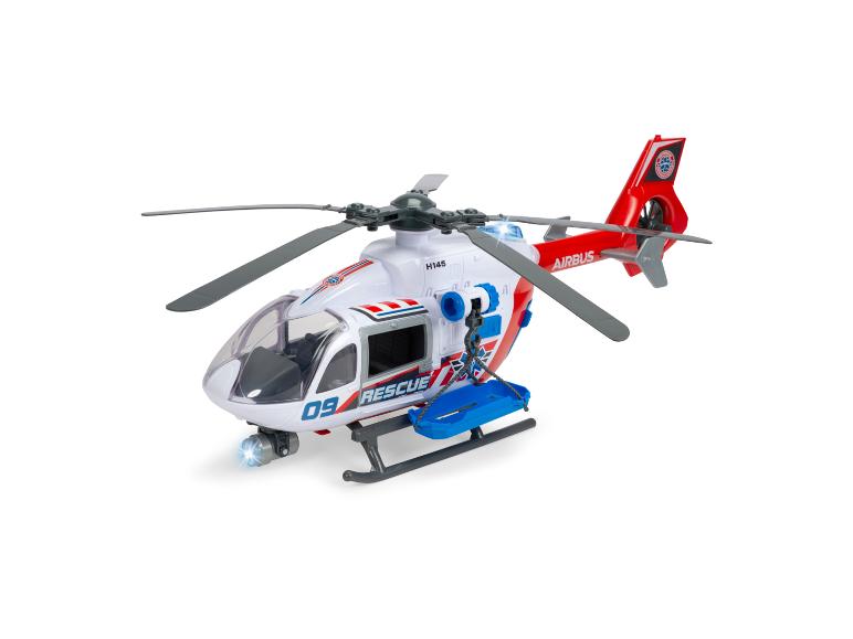 Weißer Rettungshubschrauber als Spielzeug mit roten Akzenten und Trage.