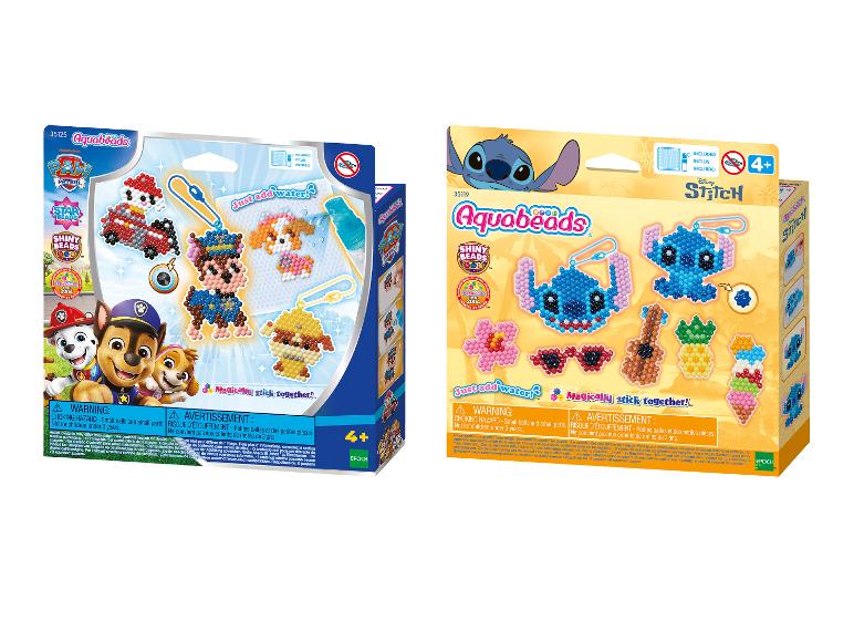 Zwei Aquabeads-Sets, eines mit Paw Patrol-Charakteren und das andere mit Disney Stitch.