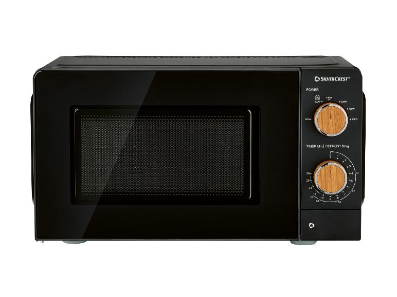 Schwarze Mikrowelle mit Bedienfeld und zwei Holzreglern für Leistung und Zeit/Auftauen.