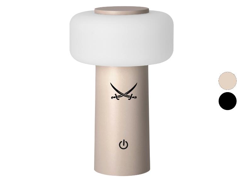 Beige tragbare Tischlampe mit weißem Diffusor, gekreuzten Säbeln und Ein-/Ausschalter.