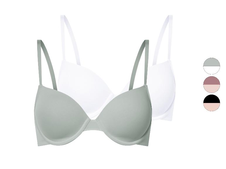 Zwei BHs, einer hellgrün, einer weiß.