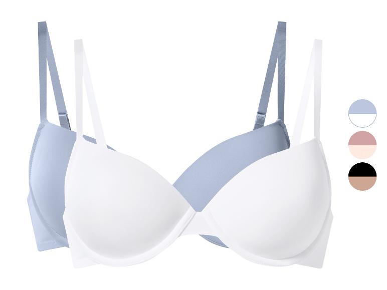 Set aus zwei BHs, einem hellblauen und einem weißen, mit Farbmustern.