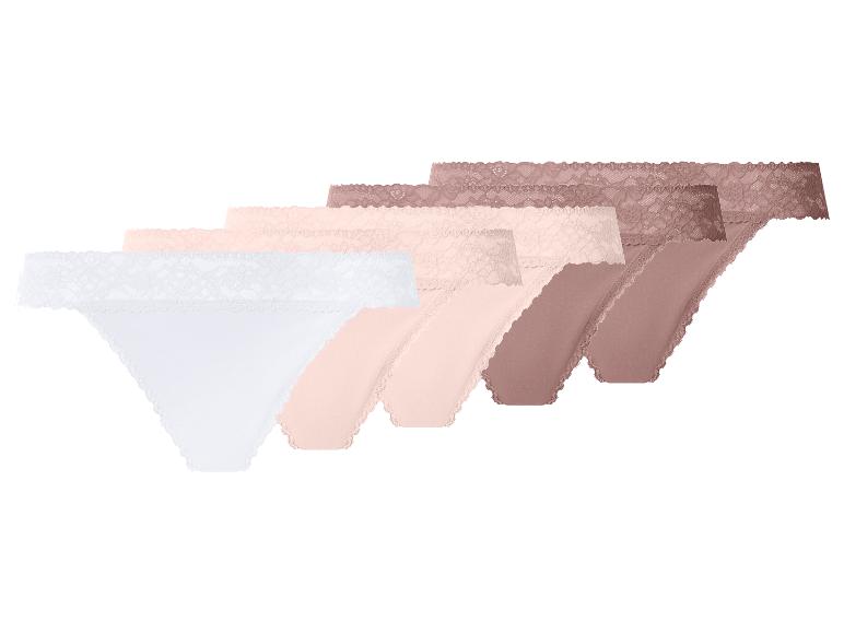 Sechs Damen-Spitzen-Strings in verschiedenen Nude-Tönen und Weiß.