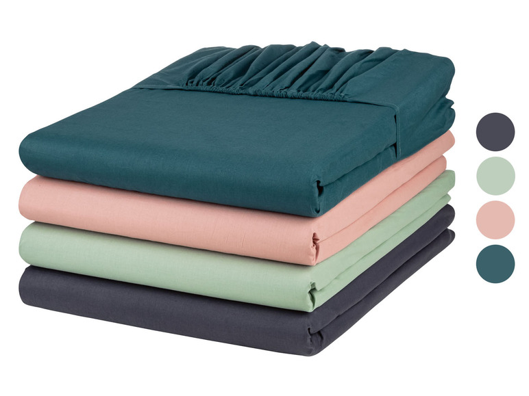 Stapel mit verschiedenen Bettlaken-Farben in Teal, Rosa, Hellgrün und Grau.