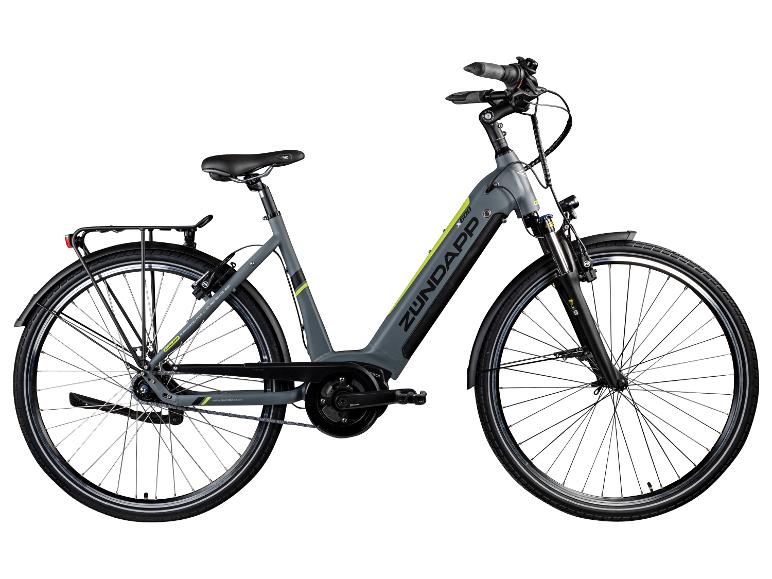 Graues Zündapp E-Bike mit gelben Details und Gepäckträger.