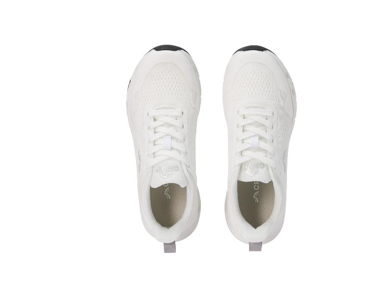 Ein Paar weiße Sportschuhe mit schwarzen und grauen Details, von oben gesehen.
