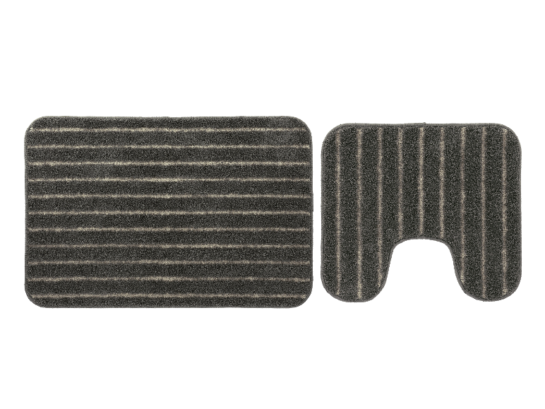 Grauer Badezimmerteppich und WC-Vorleger.