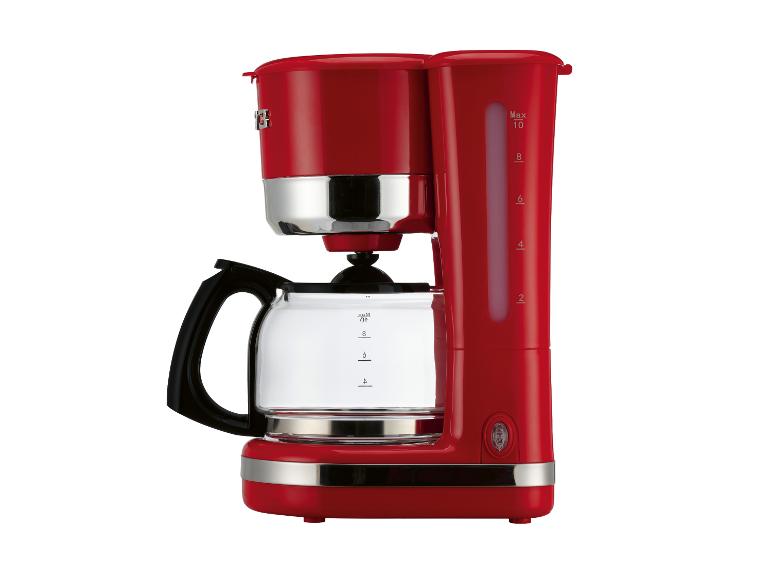 Rote Kaffeemaschine mit Glaskanne und sichtbarer Wasserstandsanzeige.