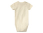 Ein cremefarbener Baby-Body.