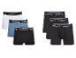 Sechs Reebok Boxershorts für Herren in Weiß, Blau und Schwarz.