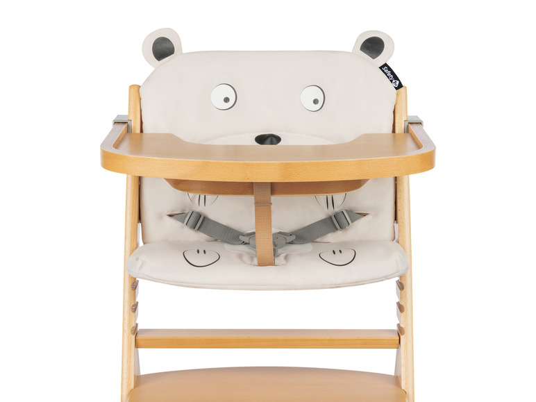 Ein weißer Safety 1st Hochstuhl mit einem Bärenkopf-Design.