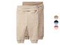 Zwei beige und hellbraune Babyhosen mit Bündchen und umklappbarem Bund.