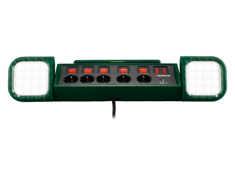 Grüne Parkside Steckdosenleiste mit vier Steckdosen, vier Schaltern und zwei LED-Leuchten.