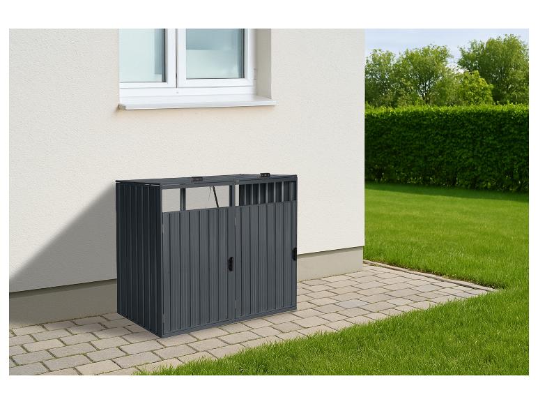 Dunkelgraue Metall-Mülltonnenbox neben einem Haus mit Rasen