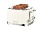 Cremefarbener Toaster mit vier Scheiben dunklem Brot und der Aufschrift „1973“.