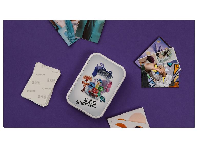 Tragbarer Canon Zink Fotodrucker mit Papier und Fotos, inklusive Alles steht Kopf 2 Thema.
