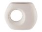 Ein weißer, runder, ovaler Topf mit einem Loch in der Mitte.