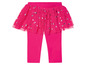 Rosa Leggings mit Tüllrock und Punkten.