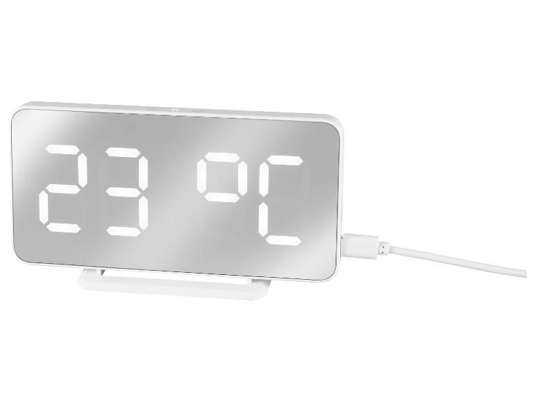 Weiße Digitaluhr mit Temperaturanzeige und Ladekabel