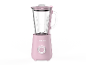 Rosa Mixer mit Glaskanne und silbernem Bedienknopf.