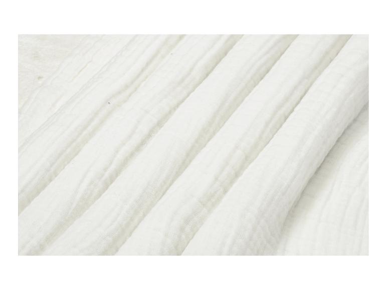 Nahaufnahme von weißem, zerknittertem Baumwollstoff.