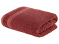 Ein zusammengerolltes, dunkelrotes Handtuch.