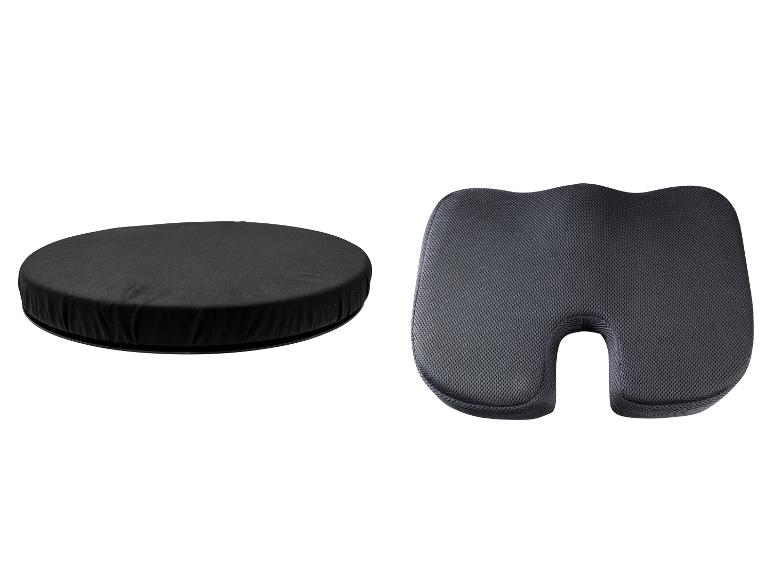 Schwarzes rundes Sitzkissen und graues ergonomisches Steißbeinkissen.