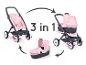 Ein rosa Maxi-Cosi Kinderwagen, der in einen Buggy und eine Babywanne umgewandelt werden kann.