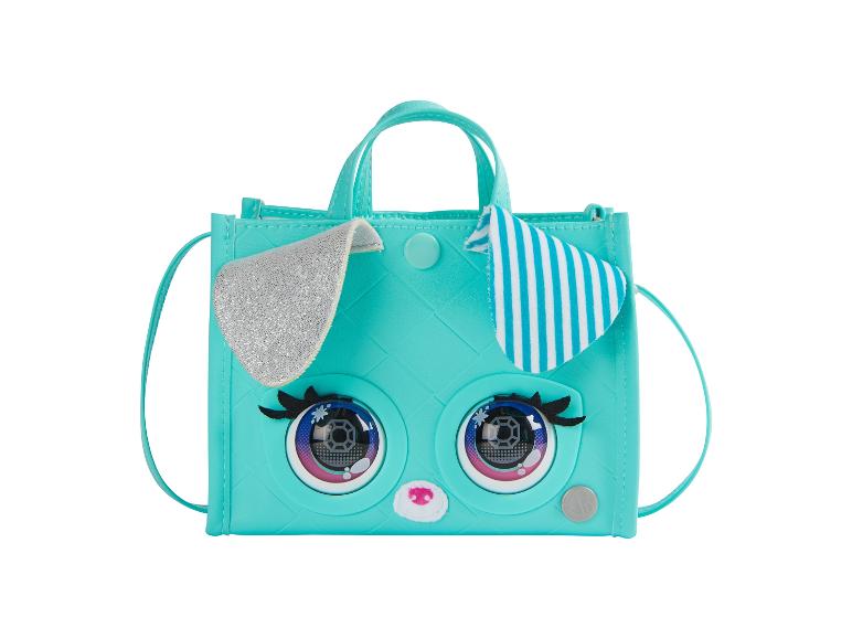 Eine türkisfarbene Handtasche mit einem niedlichen Gesicht