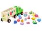 Holzspielzeug Lastwagen mit Formensortierer und Peppa Wutz Figuren.